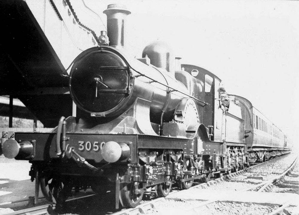 GWR 4-2-2 'Achilles class' No 3050 'Royal Sovereign' is seen standing on the down relief line at the head of a Birmingham bound train
