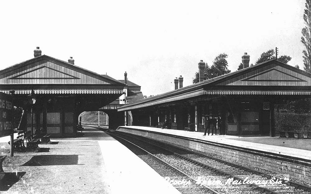  Another view of Acocks Green station looking towards Birmingham along relief platform 3 with station staff posed on the down main platform