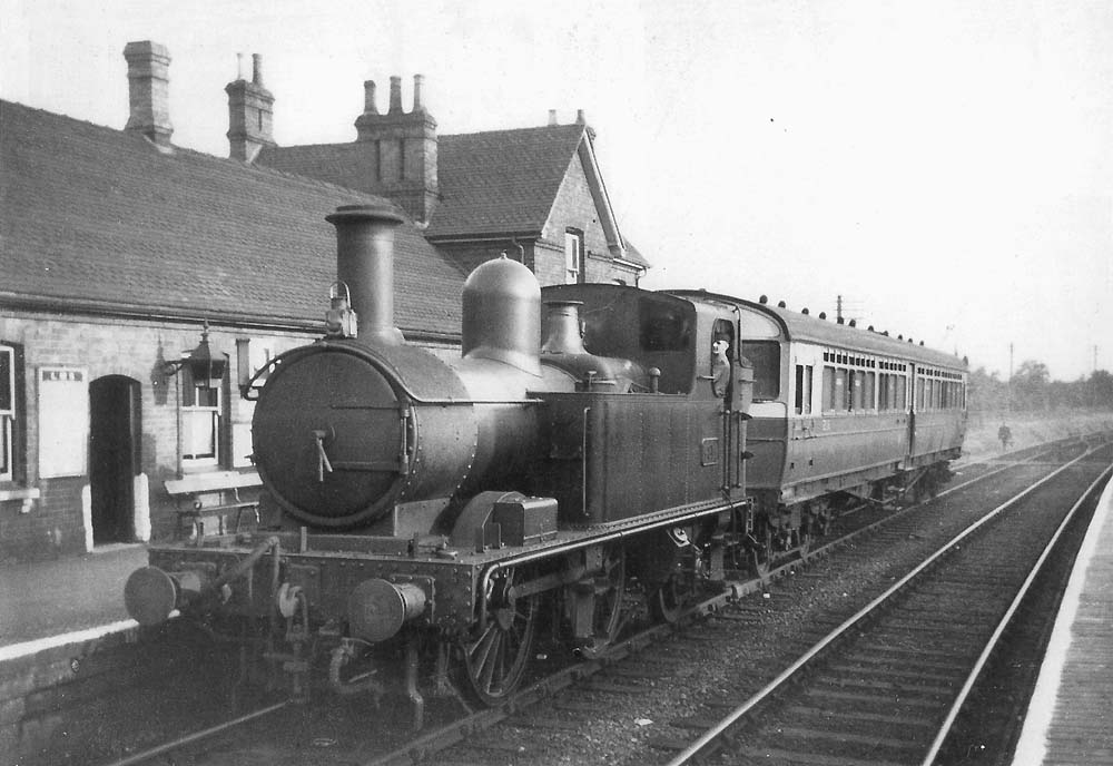 GWR Collett 48xx class 0-4-2T No 4814 with 70 diagram A29 auto trailer No 216 stands in Alcester down platform