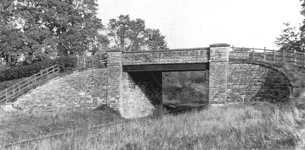 The road bridge viewed from Aston Cantlow Halte seen on 28th February 1953