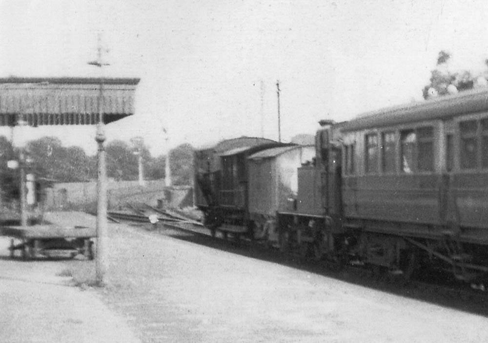 Close up showing the goods wagons being shunted forward into the goods yard by the 0-4-2T locomotive