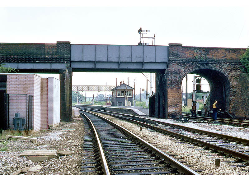 Looking towards Warwick beneath Station Road bridge showing the building housing the new signalling equipment on the left on 17th August 1969