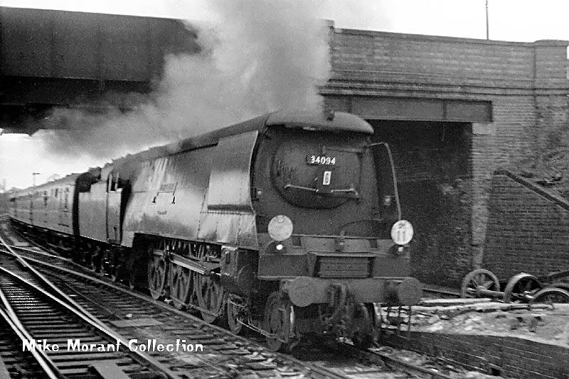 West Country Class 4-6-2 No 34094 'Mortehoe' passes under Station Road bridge at speed on 27th April 1963
