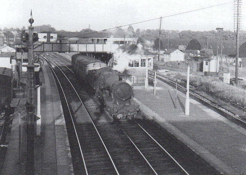 GWR 4-4-0 'Bulldog Class' No 3377 coasts through Hatton station en route for Stratford on Avon with a single coach in tow in 1947