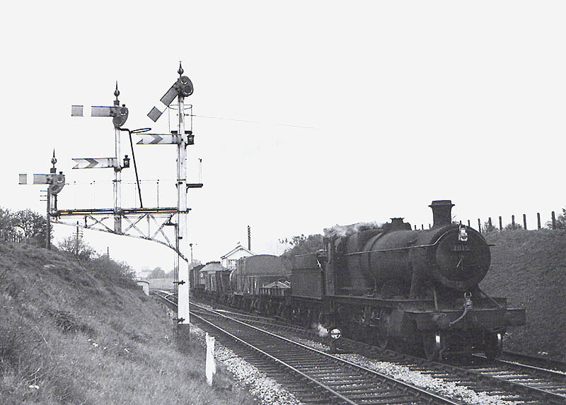 Ex-GWR 2-8-0 No 3515 proceeds past Hatton West signal box with a train for Stratford on Avon in 1950