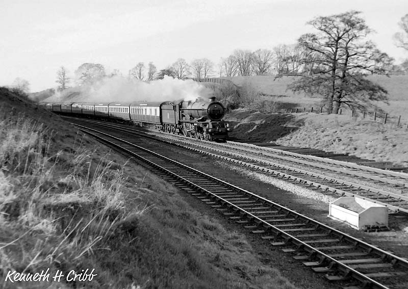 An unknown King Class 4-6-0 locomotive descends Hatton Bank at speed on an up express on 1st  December 1951