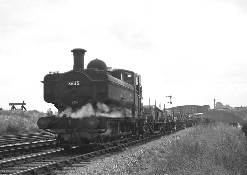 Ex-GWR 57xx Class 0-6-0PT No 3635 works a down freight under the former LMS Soho Loop line on 19th September 1964