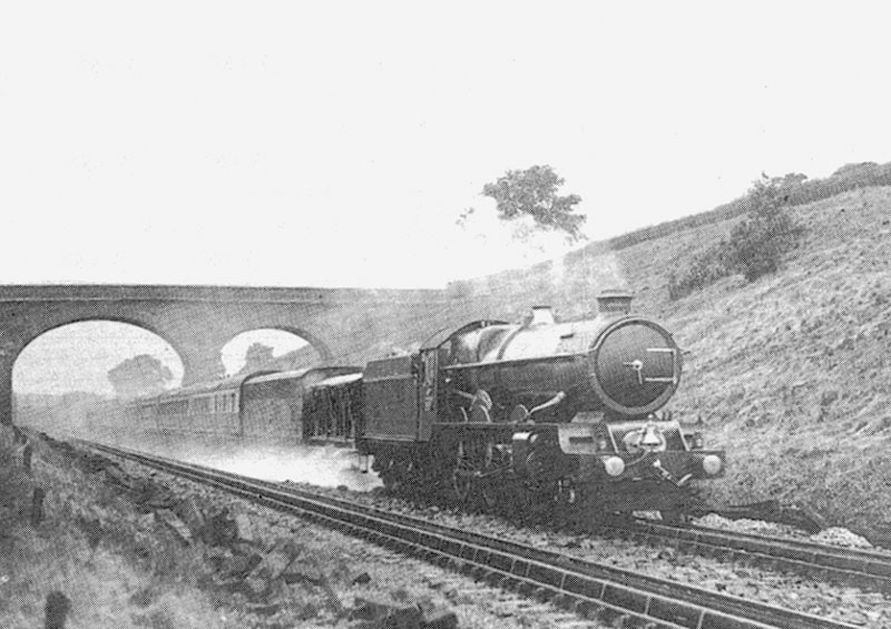 Great Western Railway 60xx (King) class 4-6-0 No 6000 King George V scoops up water from the troughs