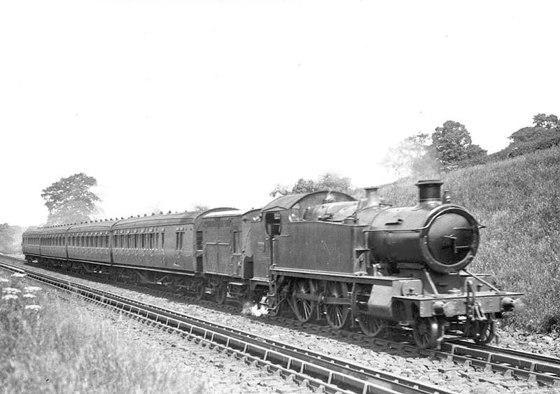 GWR 3150 Class 2-6-2T No 3186 is passes over Rowington Troughs on an up local with a horsebox behind the bunker