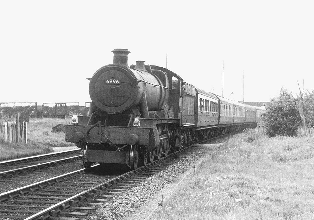 British Railways built 4-6-0 Modified Hall class No 6996 'Blackwell Hall' is seen at the head of an up West Country express service to Snow Hill in 1957