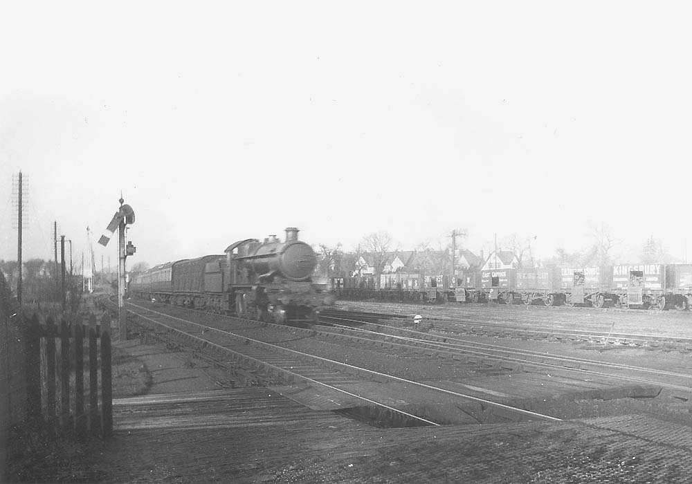 GWR 4-6-0 No 4080 'Powderham Castle' is seen at the head of an up express as it passes Solihull's original goods yard