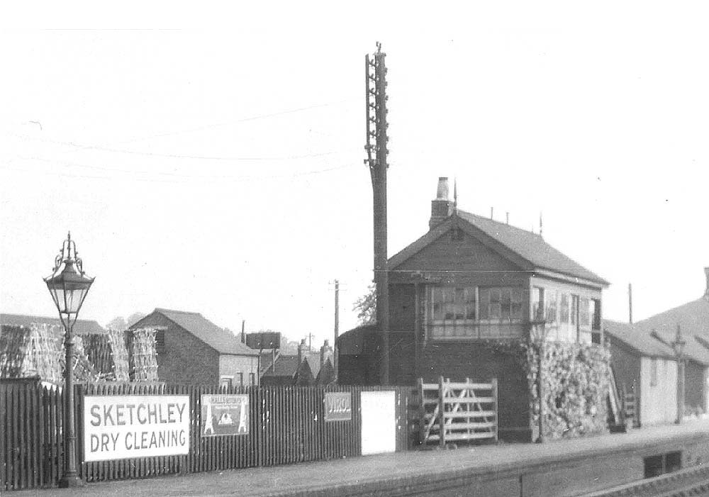 Close up showing the original signal box which was sited on the up platform and the very ornate lampposts