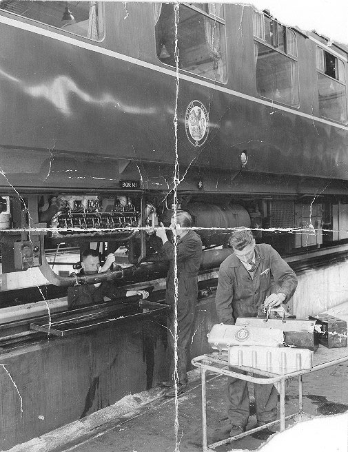 An internal view of Tyseley shed showing fitters Gerald Clapham and Alan Hughes at work in July 1958