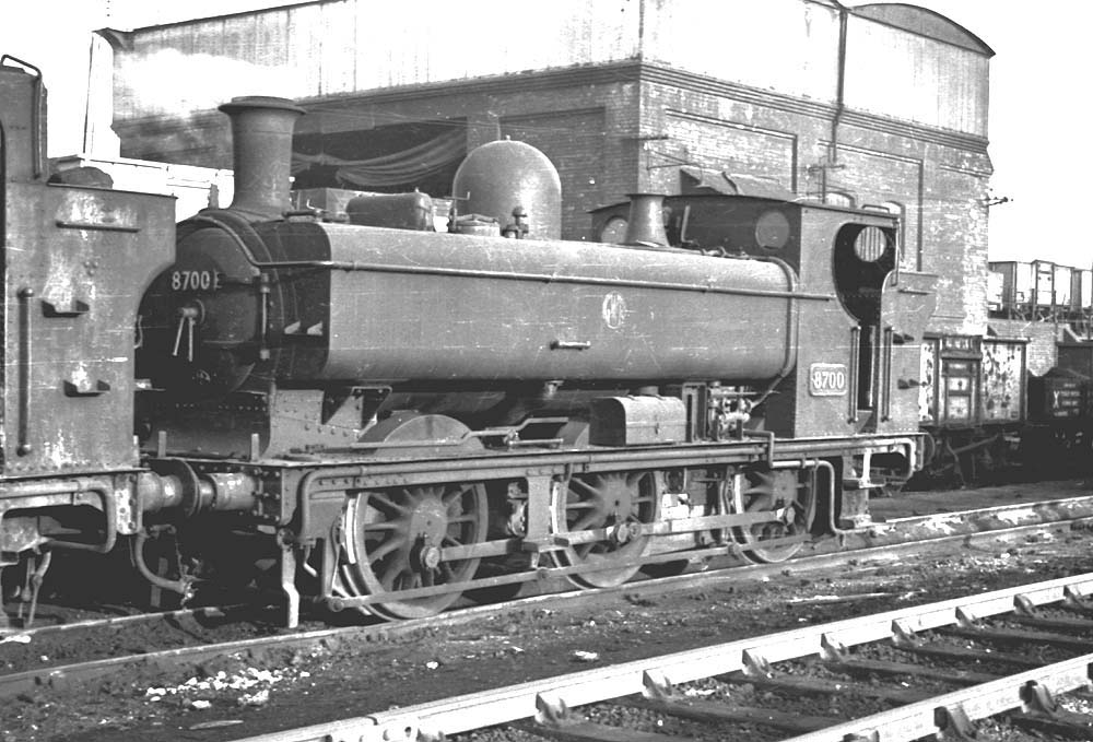 Ex-GWR 0-6-0PT 57xx Class No 8700 is seen standing on shed and still retaining its GWR button logo