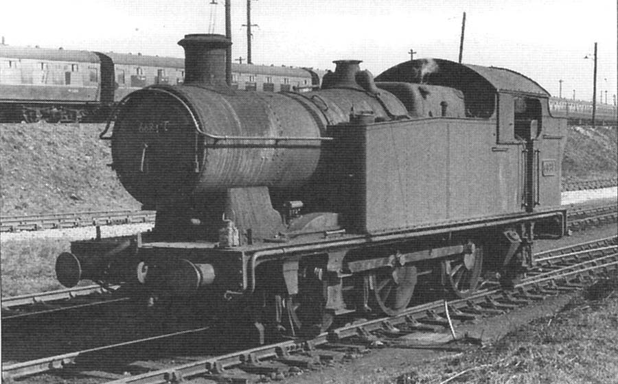 GWR 0-6-2T 56xx Class No 6681 simmers alongside Tyseley's carriage sidings in the late 1950s