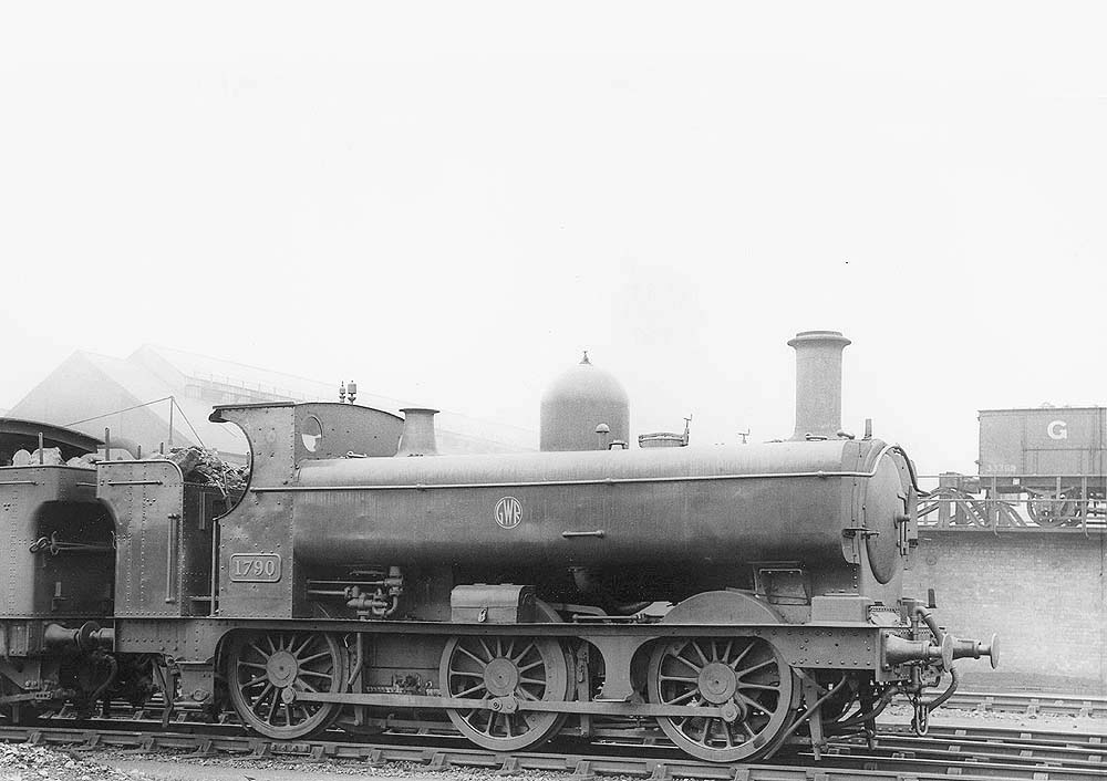 GWR 0-6-0PT No 1790, fitted with a half-cab and a member of the 655 class, is seen standing outside the shed in June 1937