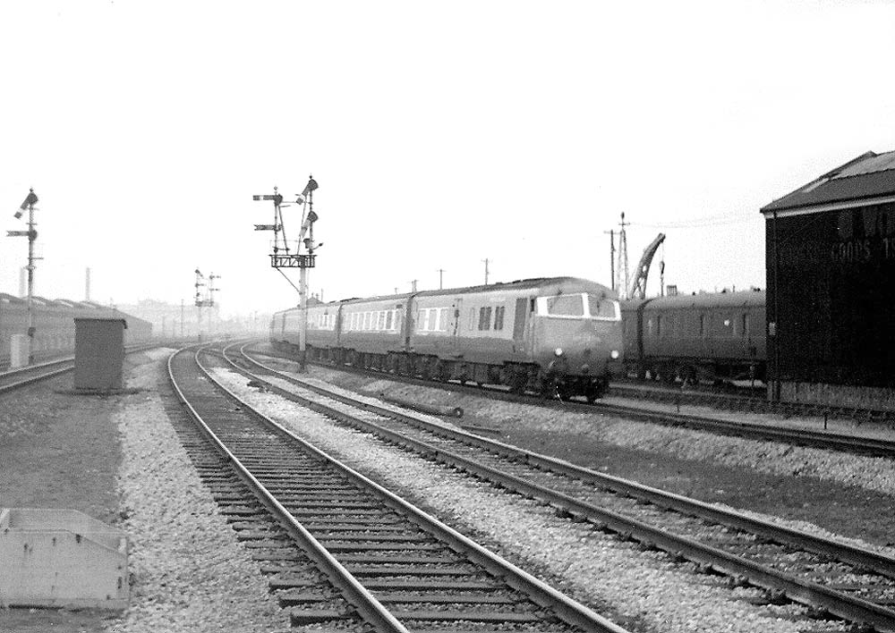 British Railways Blue Pullman is seen on the 1 00 pm Birmingham Snow Hill to Paddington up express passing the coach sidings on 15th February 1965