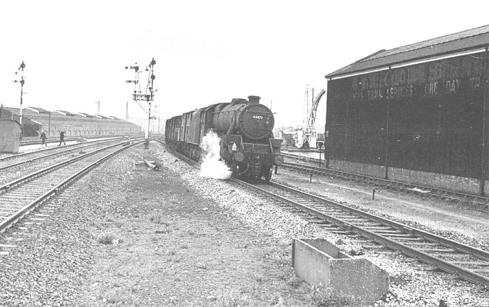 Ex-LMS 4-6-0 5MT No 44872 is seen working hard at the head of an up fitted freight service as it passes Tyseley Goods shed