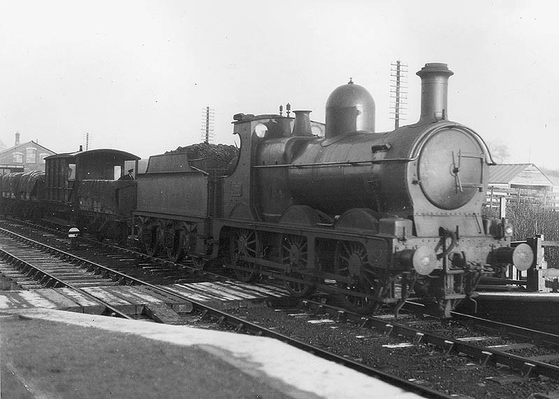 GWR 0-6-0 Dean Goods No 2439 is seen passing Widney Manor goods yard on an up loose-coupled goods train