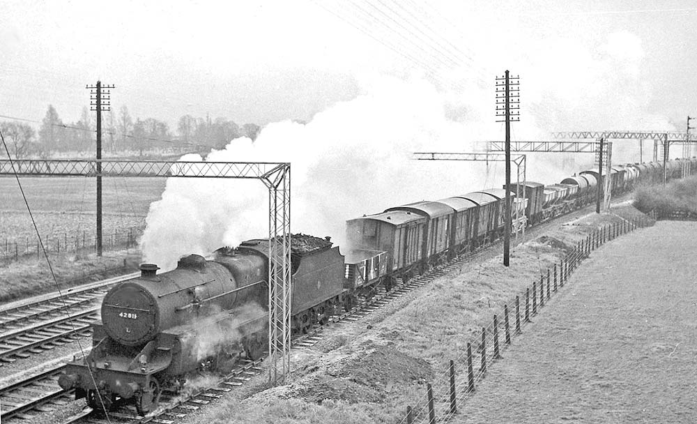 Ex-LMS 'Horwich Crab' 2-6-0 No 42811 is seen near Atherstone on a down fast freight service on 28th December 1961
