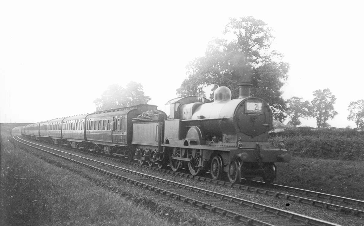 Ex-LNWR 3P 4-4-0 Precusor class No 5231 'Ganymede' is seen at the head of an up express as it approaches Berkswell station