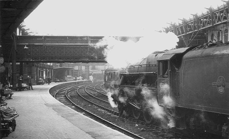 Ex-LMS 5MT 4-6-0 No 45369 is seen standing on the middle road between Platforms 9 and 10  facing West during the demolition of the roof