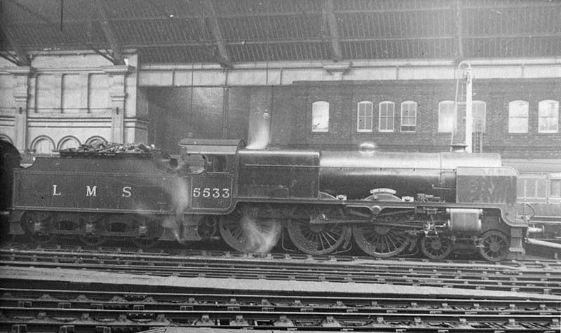 LMS 5XP 4-6-0 Patriot class No 5533 'Lord Rathmore' is seen, prior to the removal of the roof, standing at the East end of Platform 1 at the head of an up train to Euston
