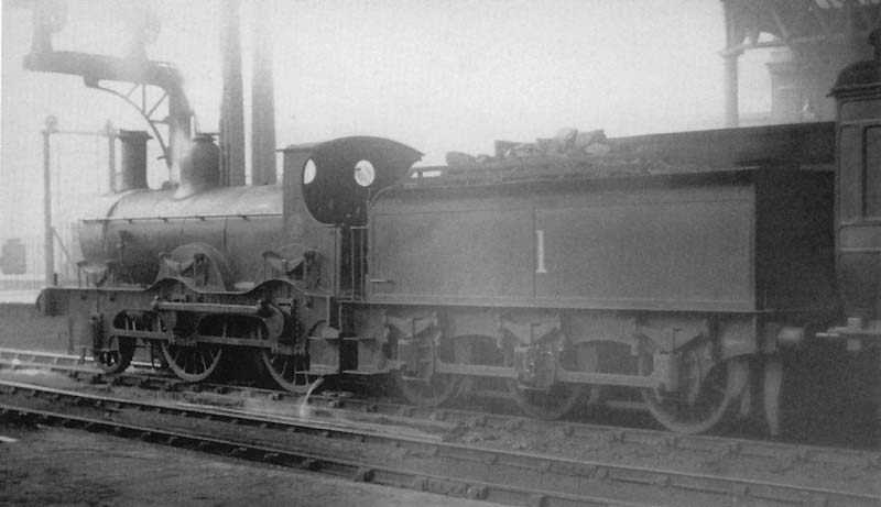 Ex-Midland Railway 2-4-0 No 1 is seen standing at the West end of Platform 5 whilst at the head of a local passenger service