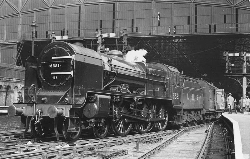 LMS 5XP 4-6-0 Patriot class No 5521 'Rhyl' is seen standing at the West end of Platform 3 at the head of a down train to Wolverhampton