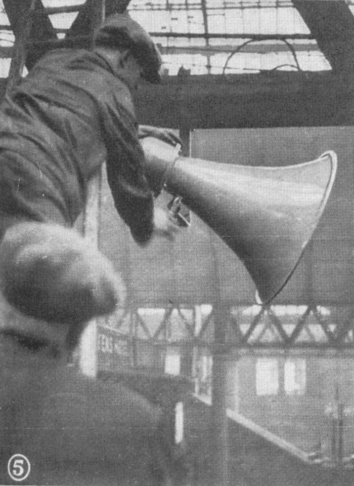 Workmen erecting one of New Street station's twenty-five loudspeakers deployed in October 1925 to improve station announcements