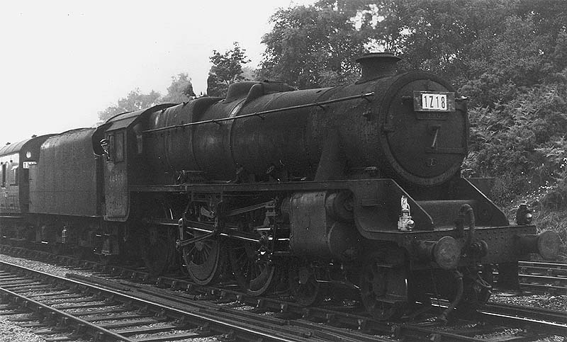 A very dirty ex-LMS 4-6-0 'Black 5' No 44963 is seen passing the junction of the Leamington branch as it arrives at platform two with a down express