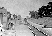 Close up of an unidentified LNWR 0-6-0 locomotive running tender first approaching the station with a Weeden to Warwick Milverton service