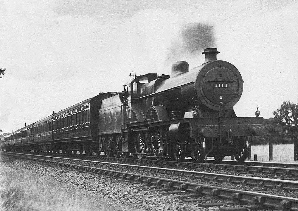 LMS 4P 4-4-0 Compound No 1111 is at the head of one of Birmingham's famed two-hour down express trains from Euston