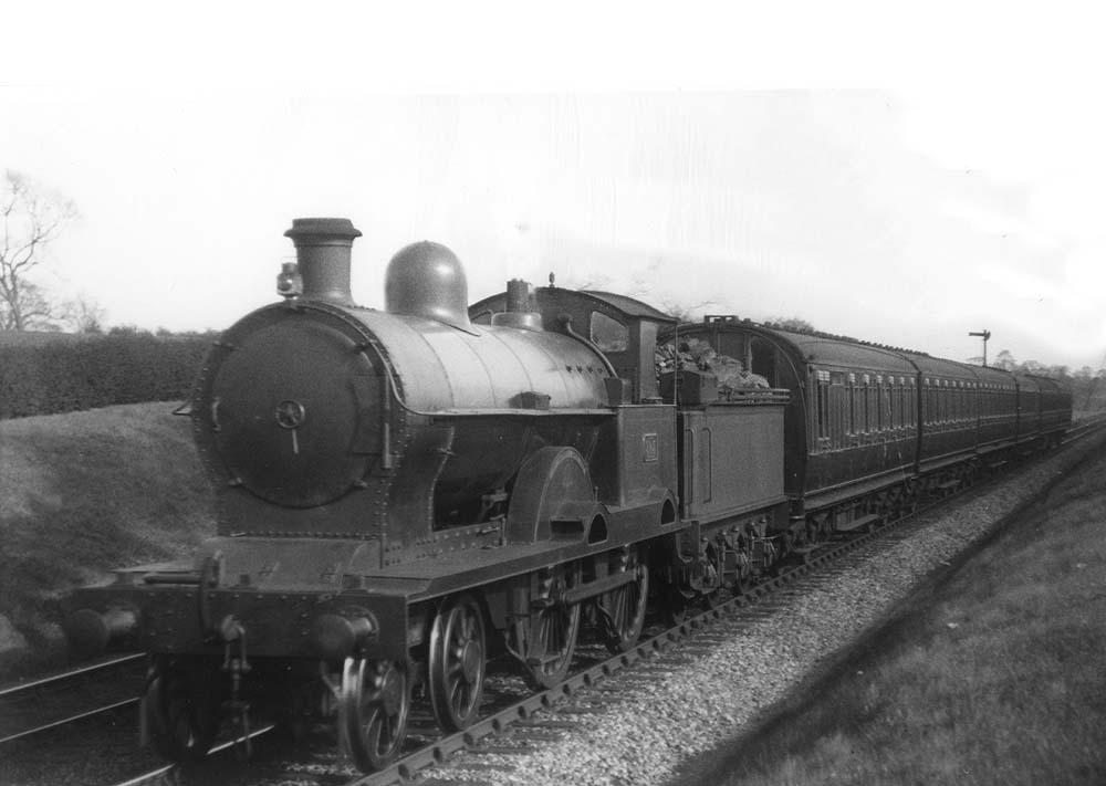 Ex-LNWR 3P 4-4-0 Precursor class No 303 'Himalaya' is seen in April 1927.at the head of a local passenger train one year before receiving its LMS number
