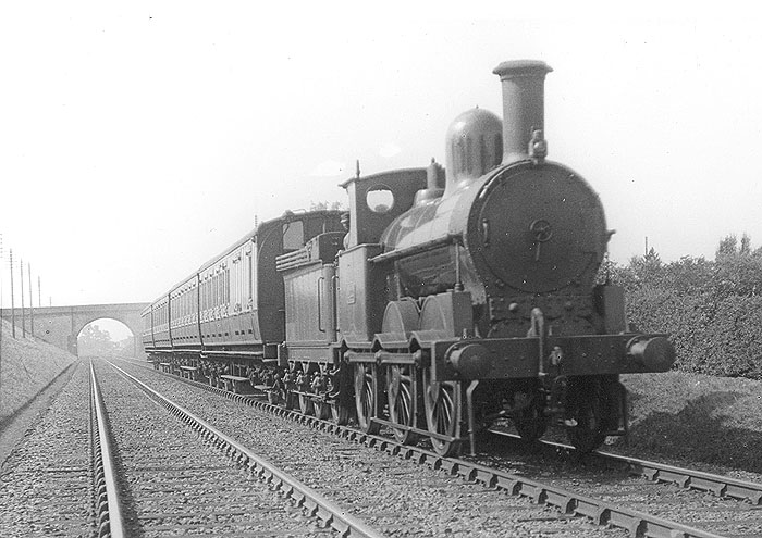 LNWR 2F 0-6-0 Cauliflower No 422 is seen at the head of an up Birmingham to Rugby local passenger service in July 1921