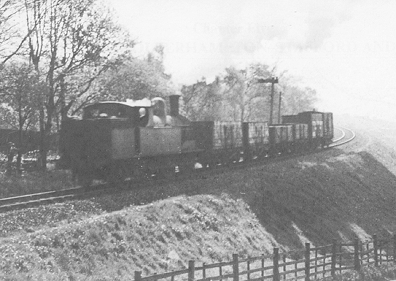 Ex-LNWR 2P Watford Tank 0-6-2T No 6927 is seen from Woodbourne Road bridge returning from Harborne
