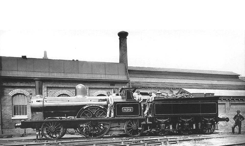LNWR 2-2-2 'Large Bloomer' No 894 'Trentham' stands alongside the former coaling stage with the original shed in the background.