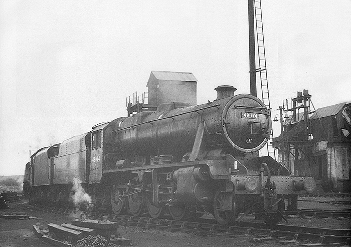 Ex-LMS 2-8-0 8F No 48074 and ex-LMS 2-8-0 8F No 48263 are seen standing tender to tender in the road adjacent to Nuneaton's Ash Plant