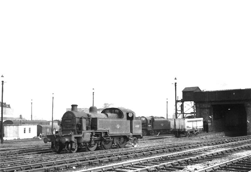 View of ex-LMS 2-6-2T 3MT No 40010 standing in front of the old LNWR Coaling stage with only the overhead water tank still in use