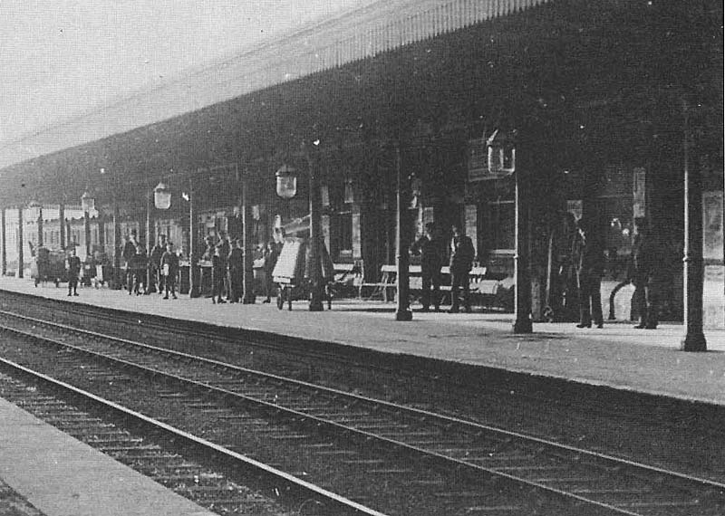 Close up showing a rake of coaches standing in the bay which is only open to the platform and the access to the Coventry branch