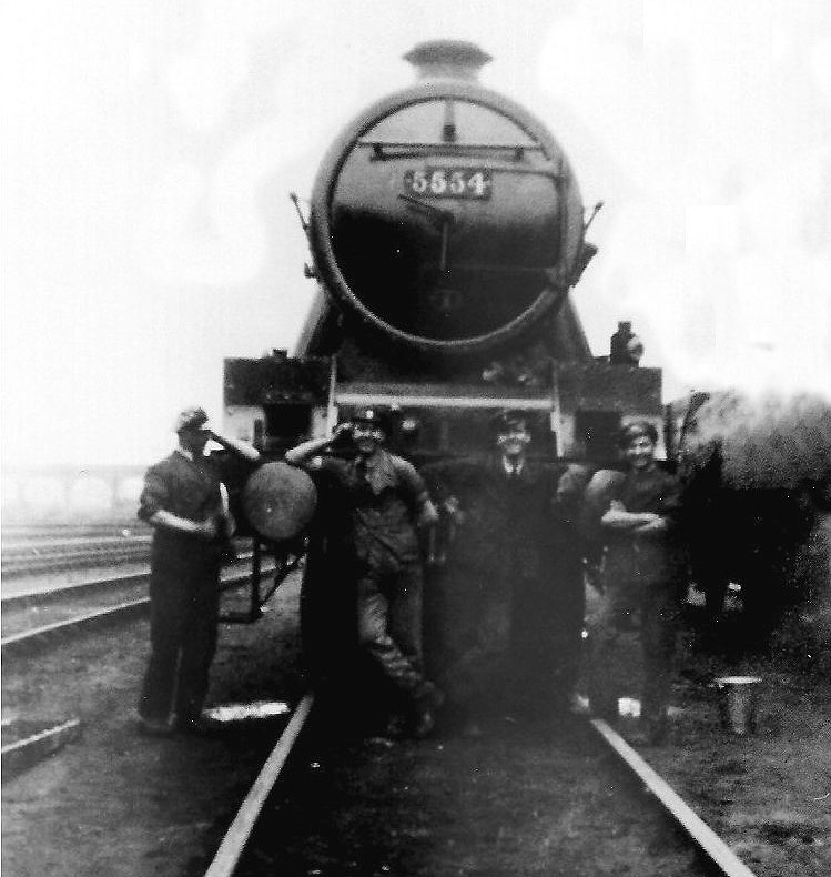 LMS 5XP 4-6-0 Jubilee Class No 5554 'Ontario' stands outside No 2 Shed with its crew and cleaners circa late 1940s