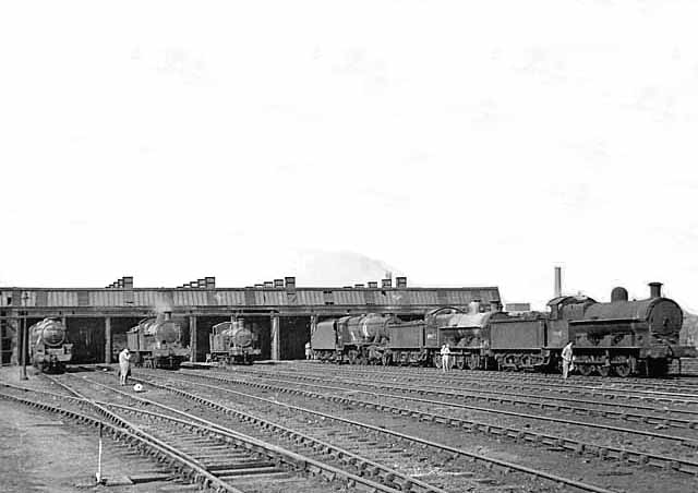 View of Rugby's locomotive yard and shed with most locomotives stabled inside on this Sunday morning in 1953