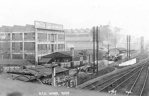 View of the BTH electrical engineering factory as seen from the footbridge with a Mazda Lamps advert on the roof