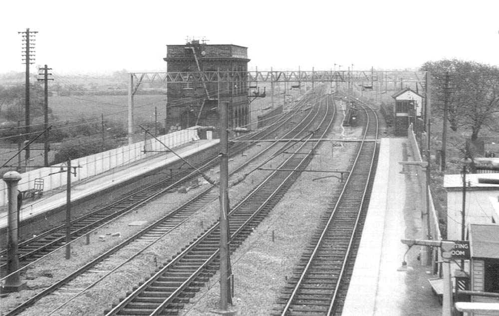 Looking towards Nuneaton and the disused Tamworth No 1 signal box from above the down slow line on 2nd June 1962
