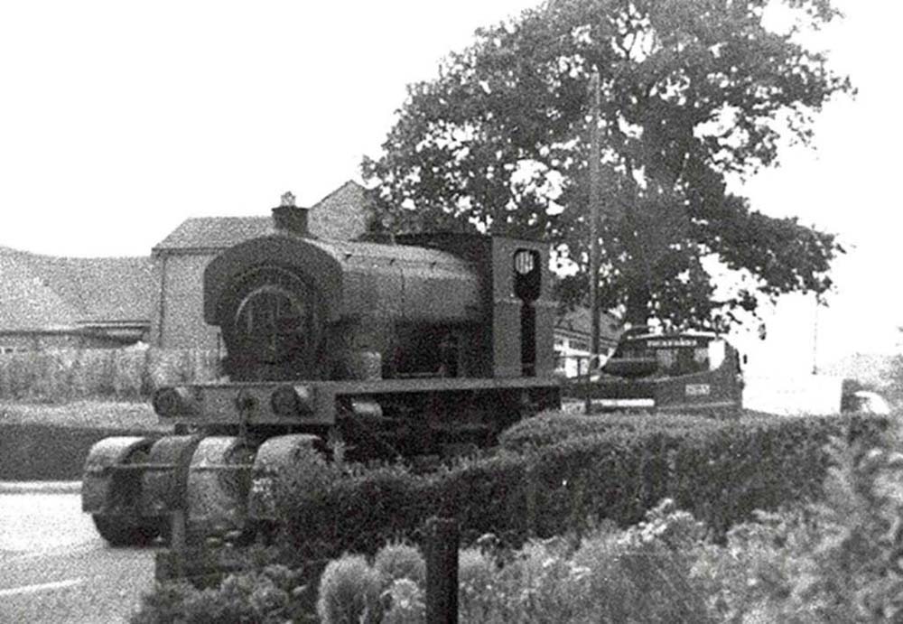 An unidentified Colliery locomotive being transported by low loader outside No 63 Gun Hill Arley