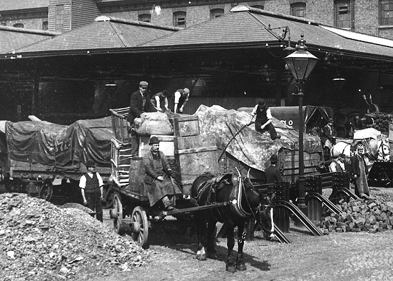Close up showing the variety of goods being off-loaded from railway wagons for onward distribution