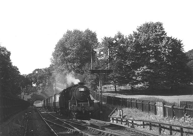 Ex-LMS 4-6-0 5MT No 45058 is seen at the head of an empty stock working for New Street on 5th September 1954