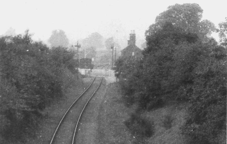 View looking towards Whitacre with the station  on the right and the goods siding on the left with the level crossing in between