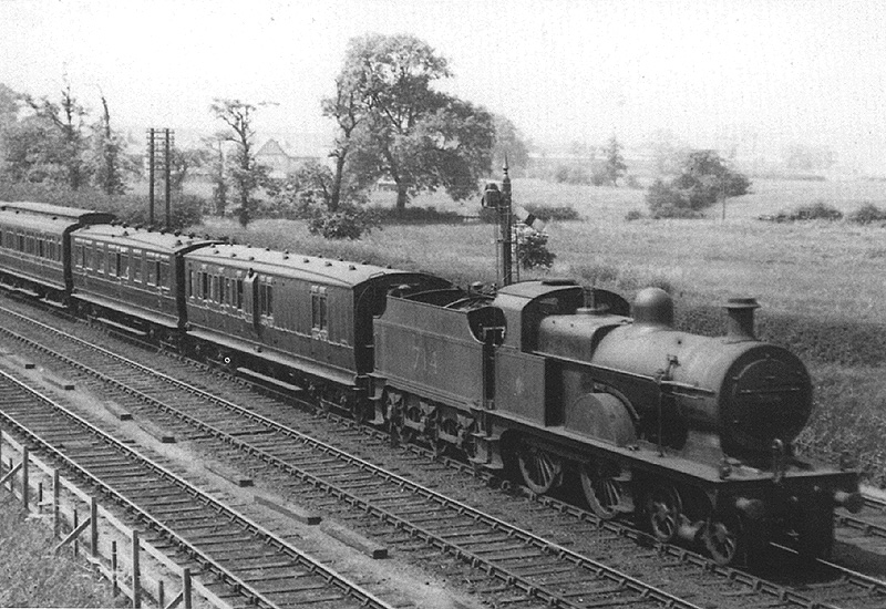 Ex-MR 3P 4-4-0 No 714 is seen north of Halesowen Junction at the head of an up express service to Birmingham