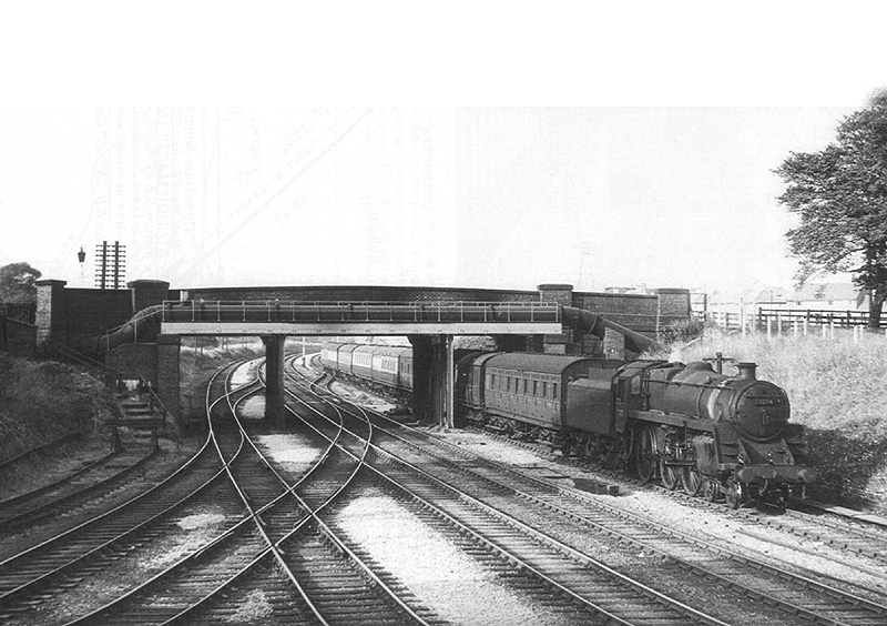 British Railways Standard Class 5MT No 73054 is seen on a down empty stock working on 29th July 1955